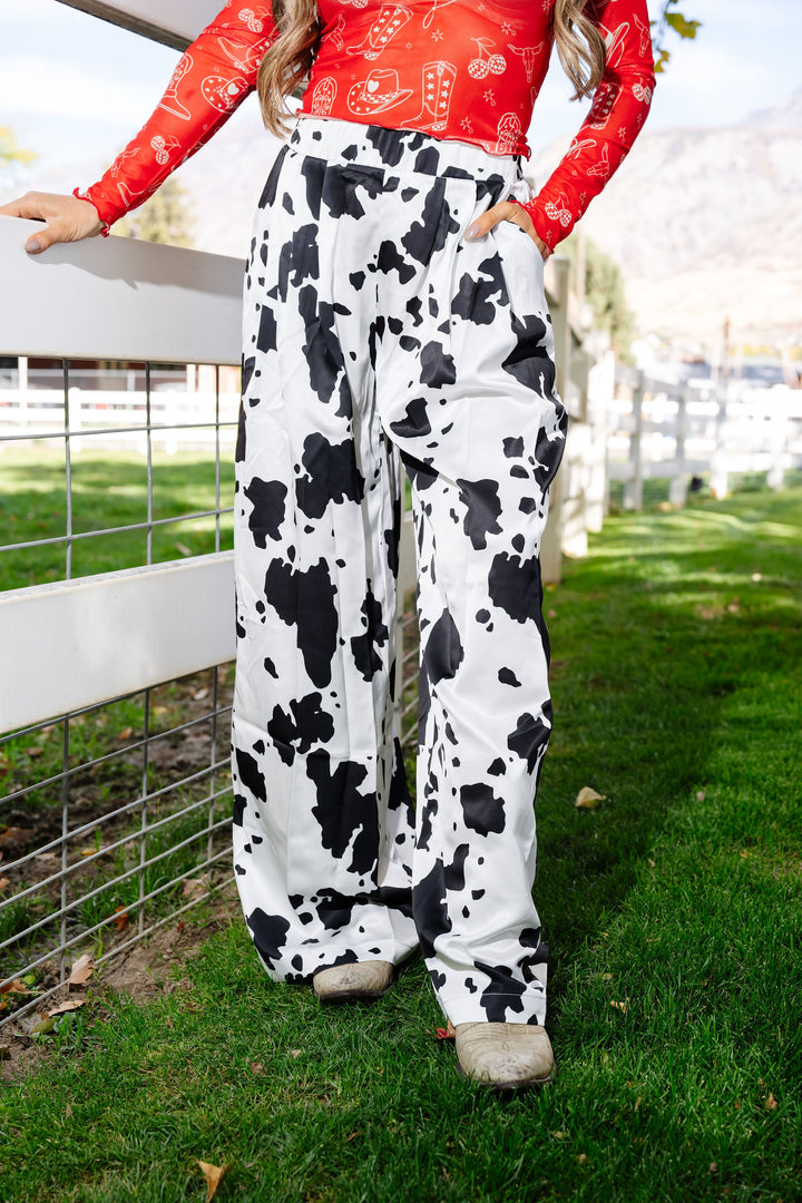 Not My First Rodeo Cow Print Pants