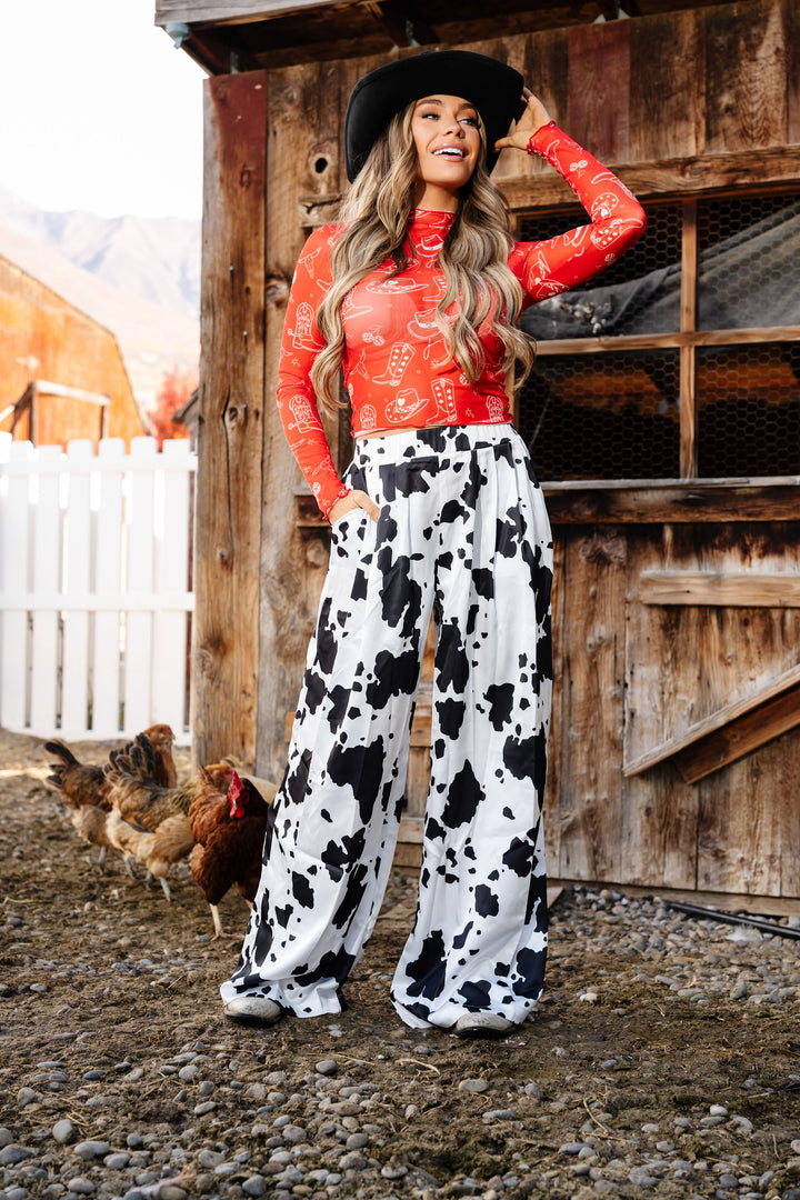 Not My First Rodeo Cow Print Pants